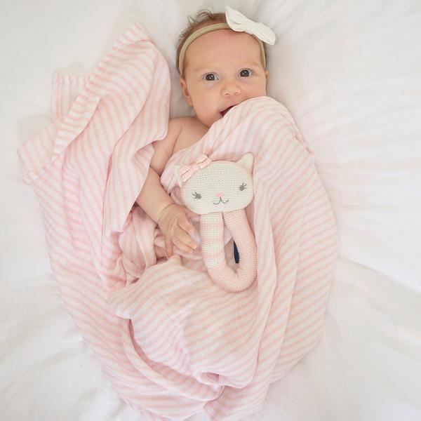 Baby-girl-cat-rattle-and-blush-stripe-muslin-swaddle-wrap-web-grande
